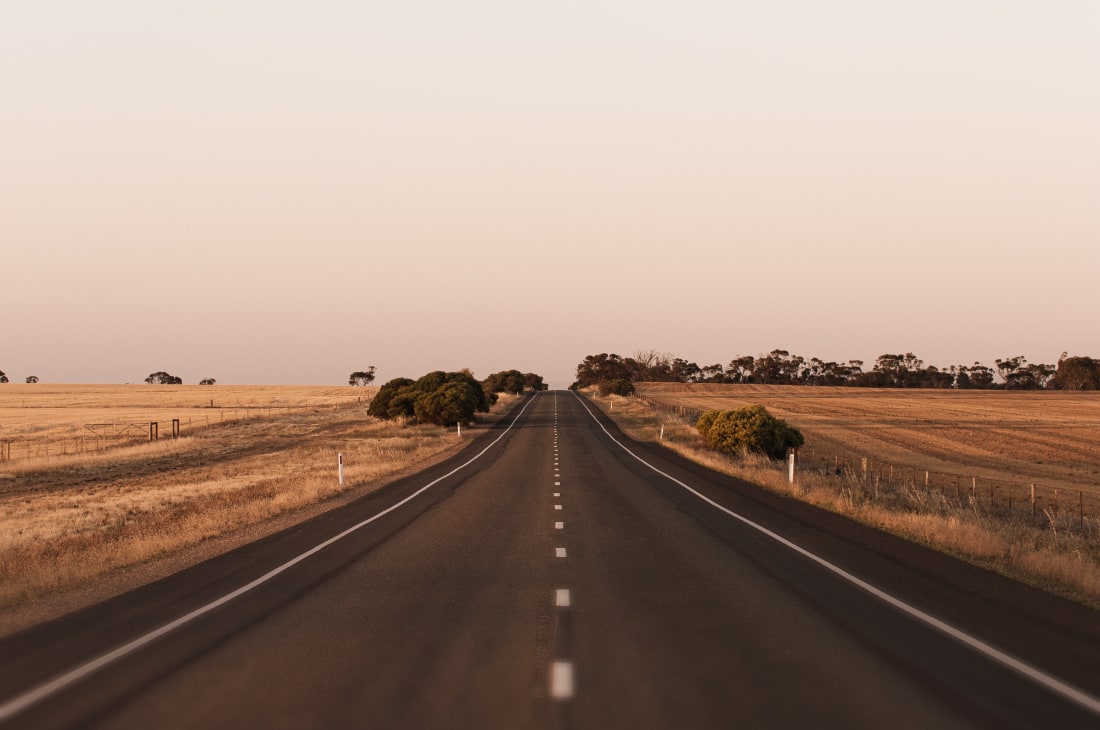 Country road running through farmland